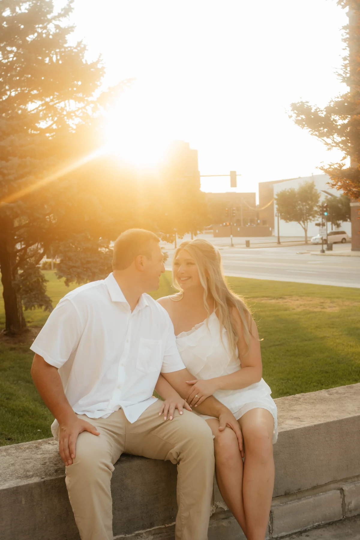 Marissa and Kyle sitting together at golden hour