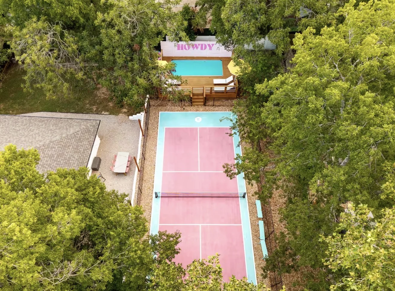 Airbnb pool deck and pickleball court